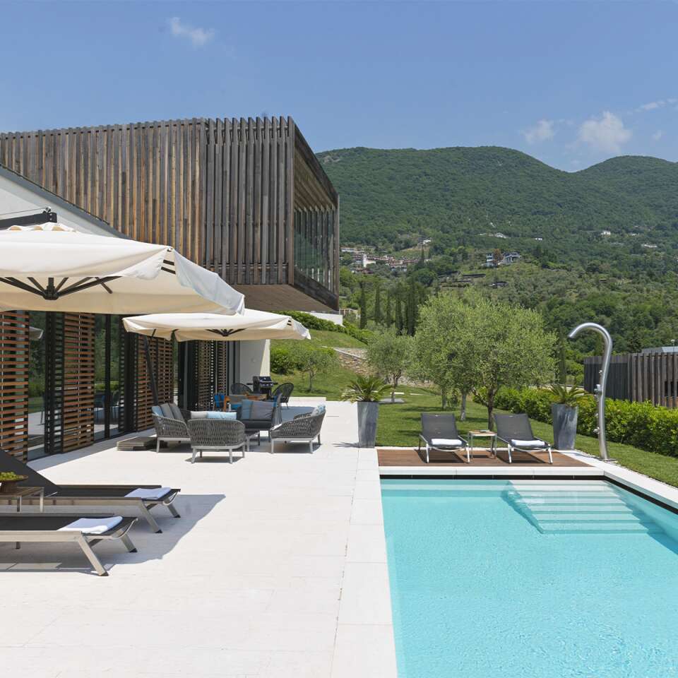 swimming pool with sunbathing area