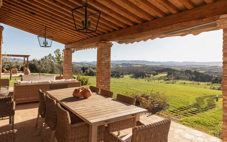 covered pergola with countryside view 