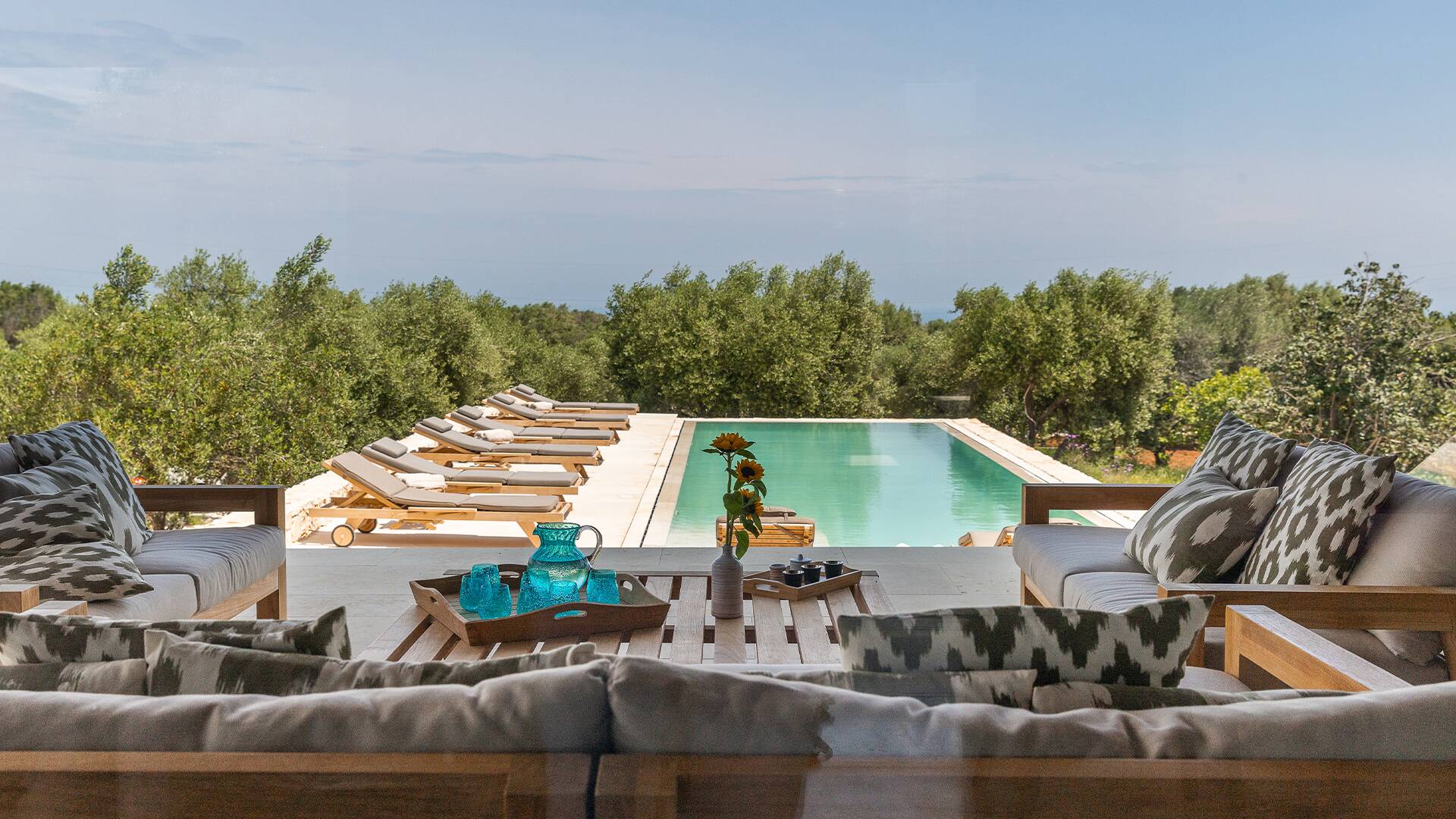 covered pergola with pool view