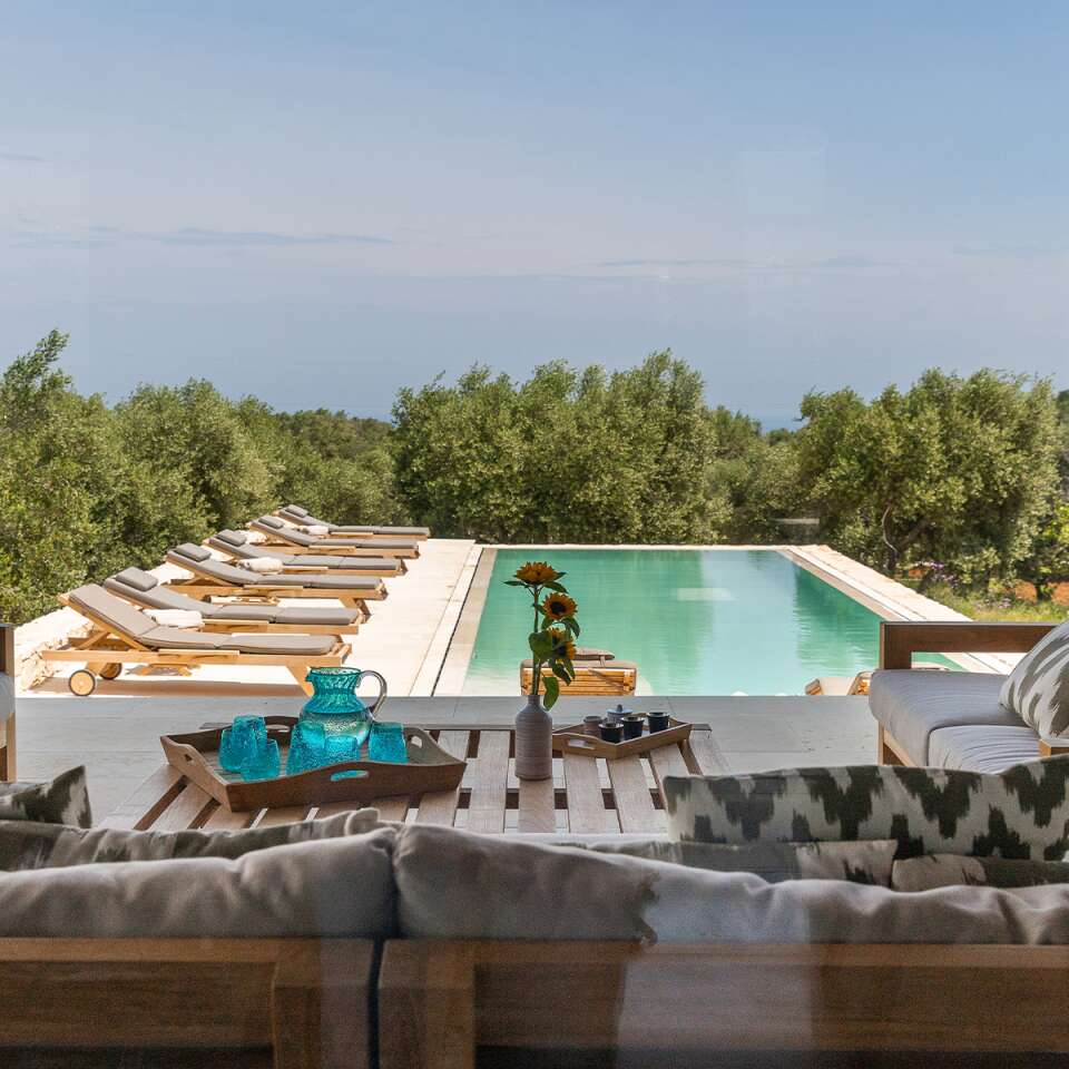 covered pergola with pool view