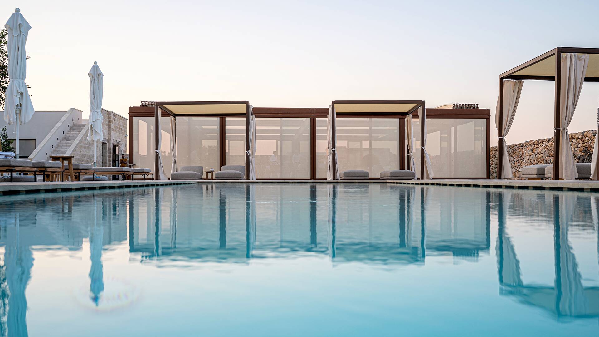 infinity pool with sunbathing area