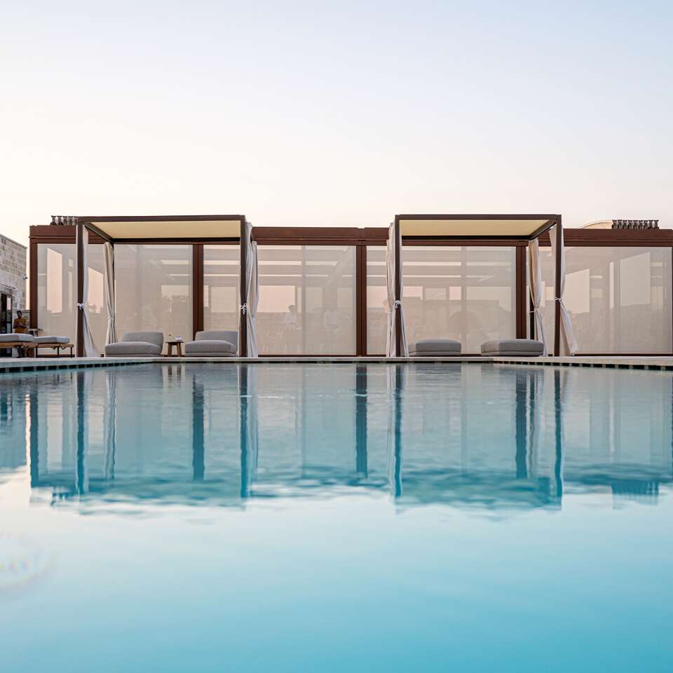 infinity pool with sunbathing area