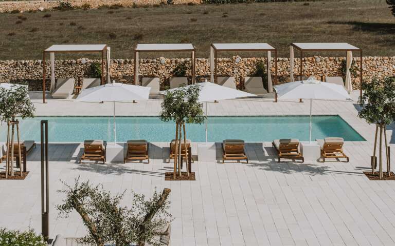 infinity swimming pool with gazebos