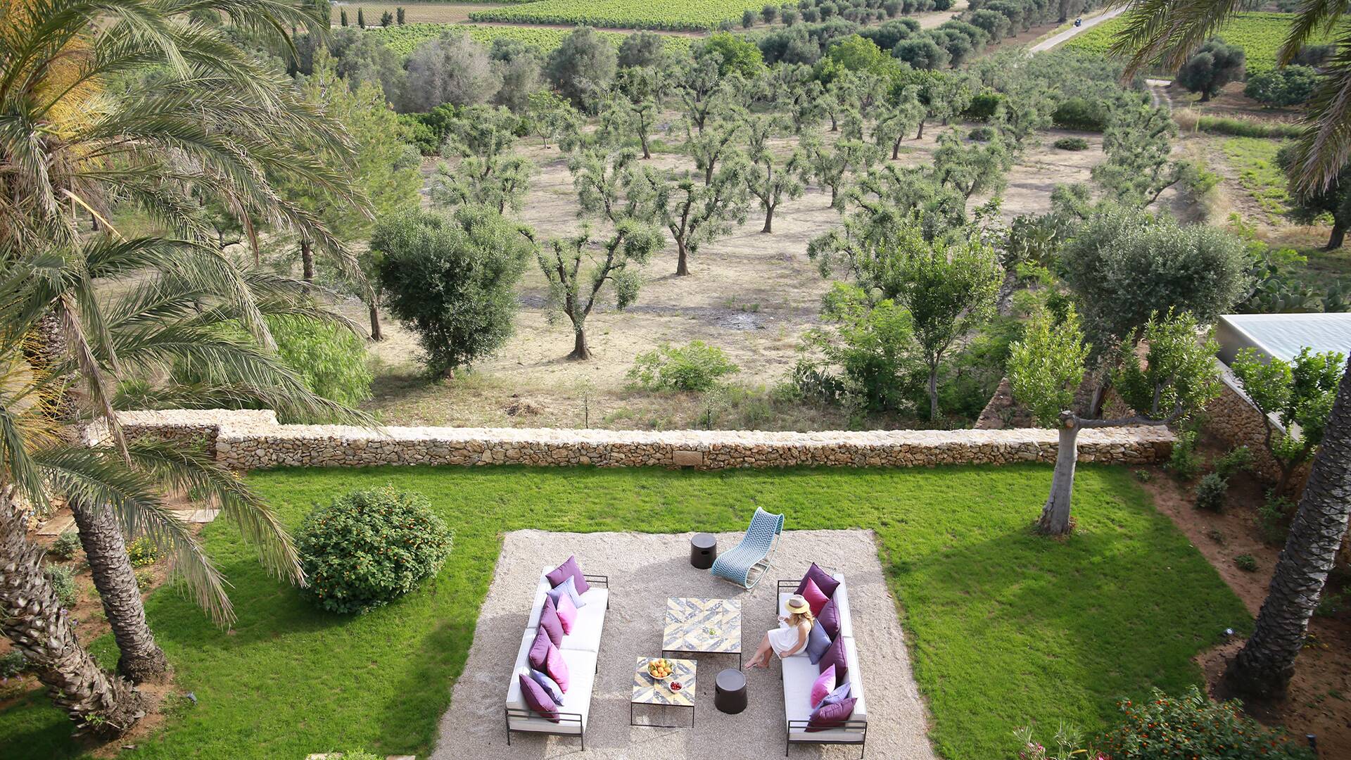 Certosa, outdoor sitting area surrounded by majestic garden