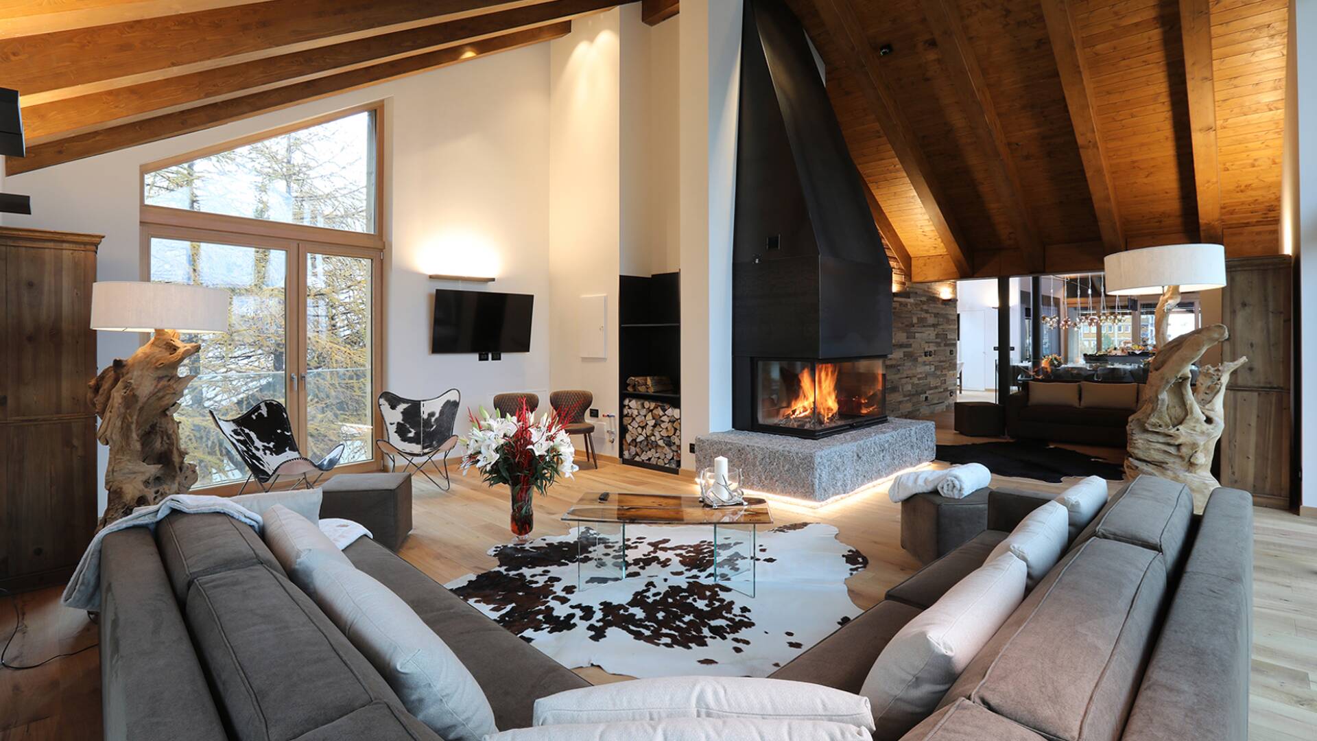 opulent living room with large sofa and TV