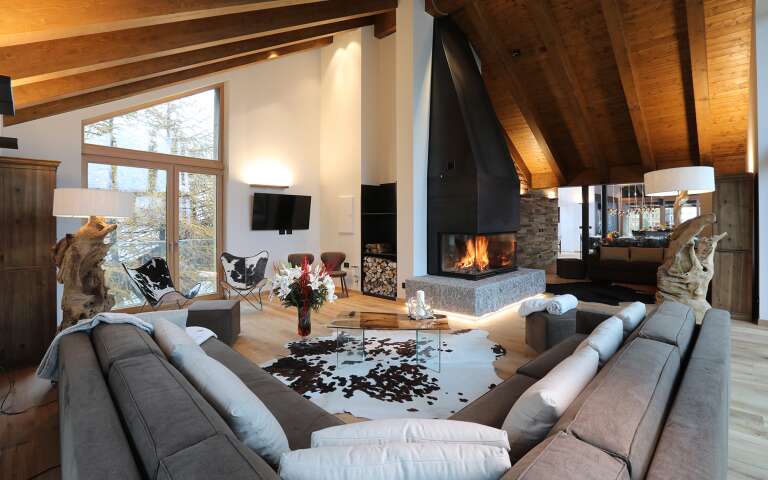 opulent living room with large sofa and TV