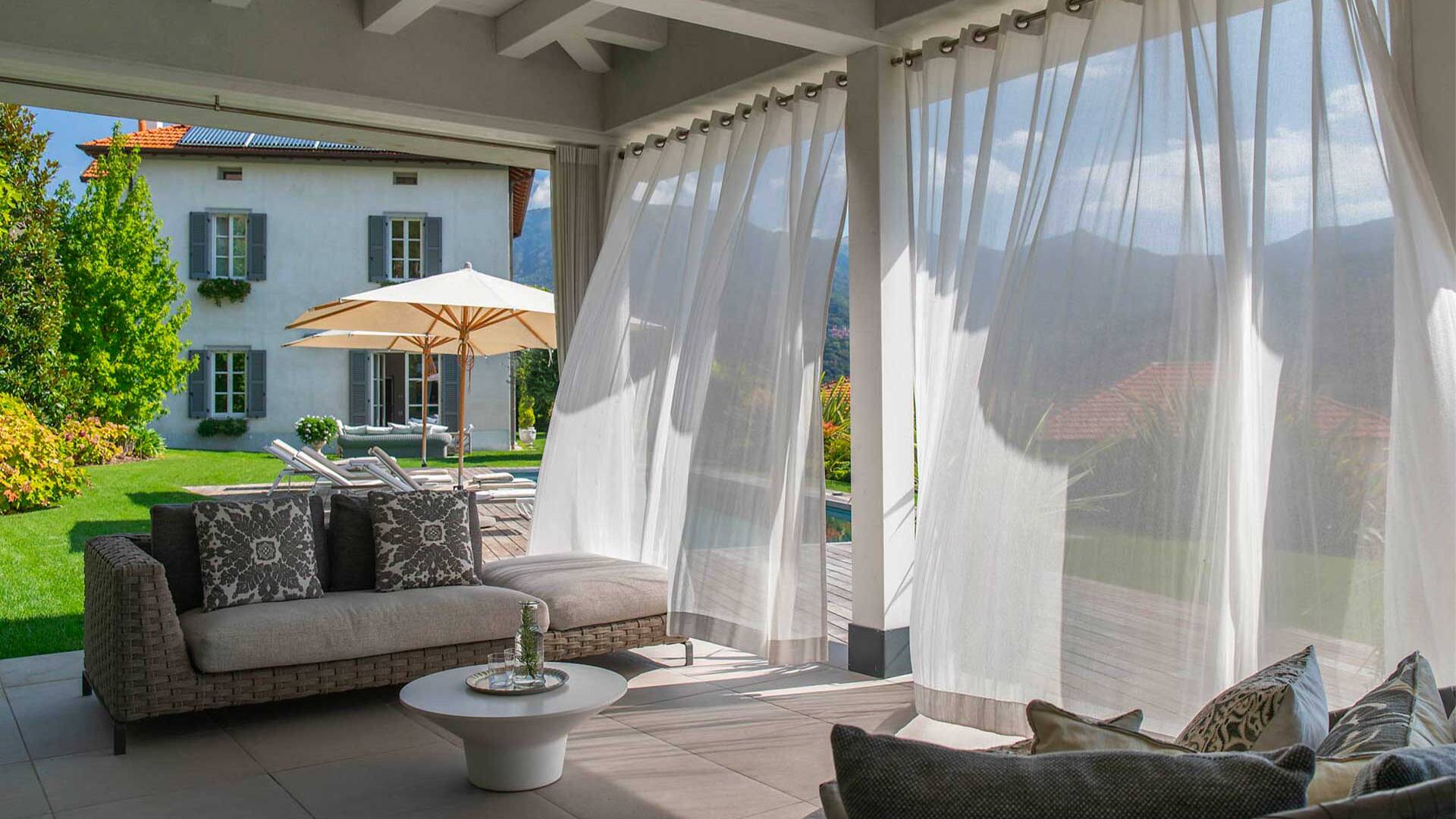 covered sitting area by private pool