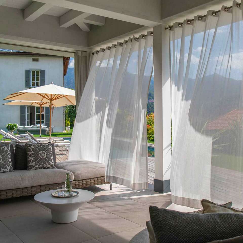covered sitting area by private pool