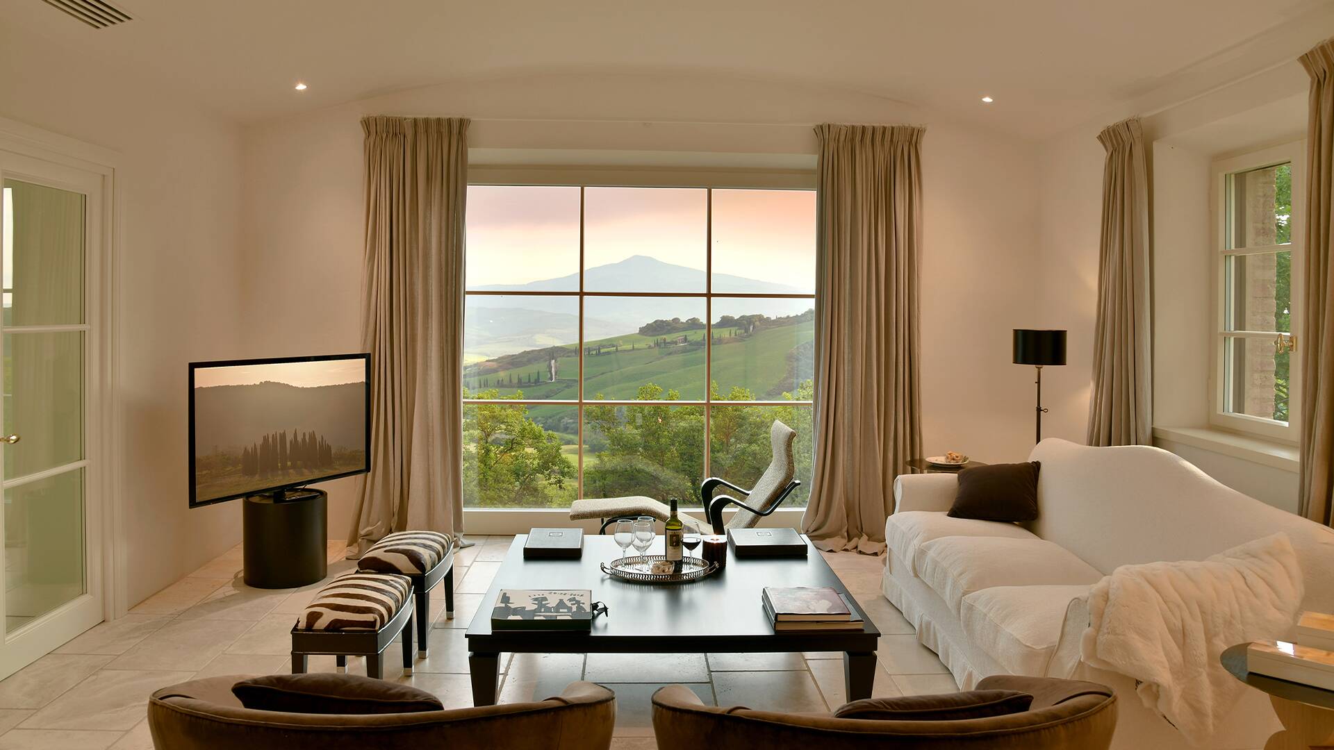 living room with French windows and view over Tuscan countryside