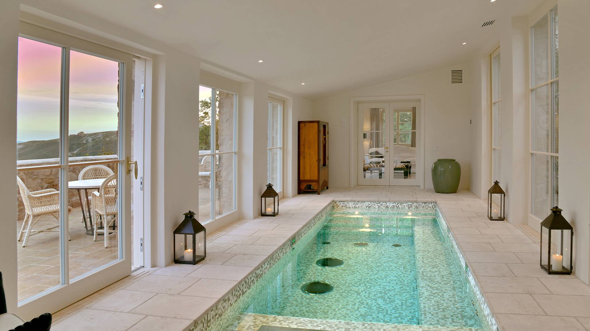 indoor pool with access to outdoor sitting area