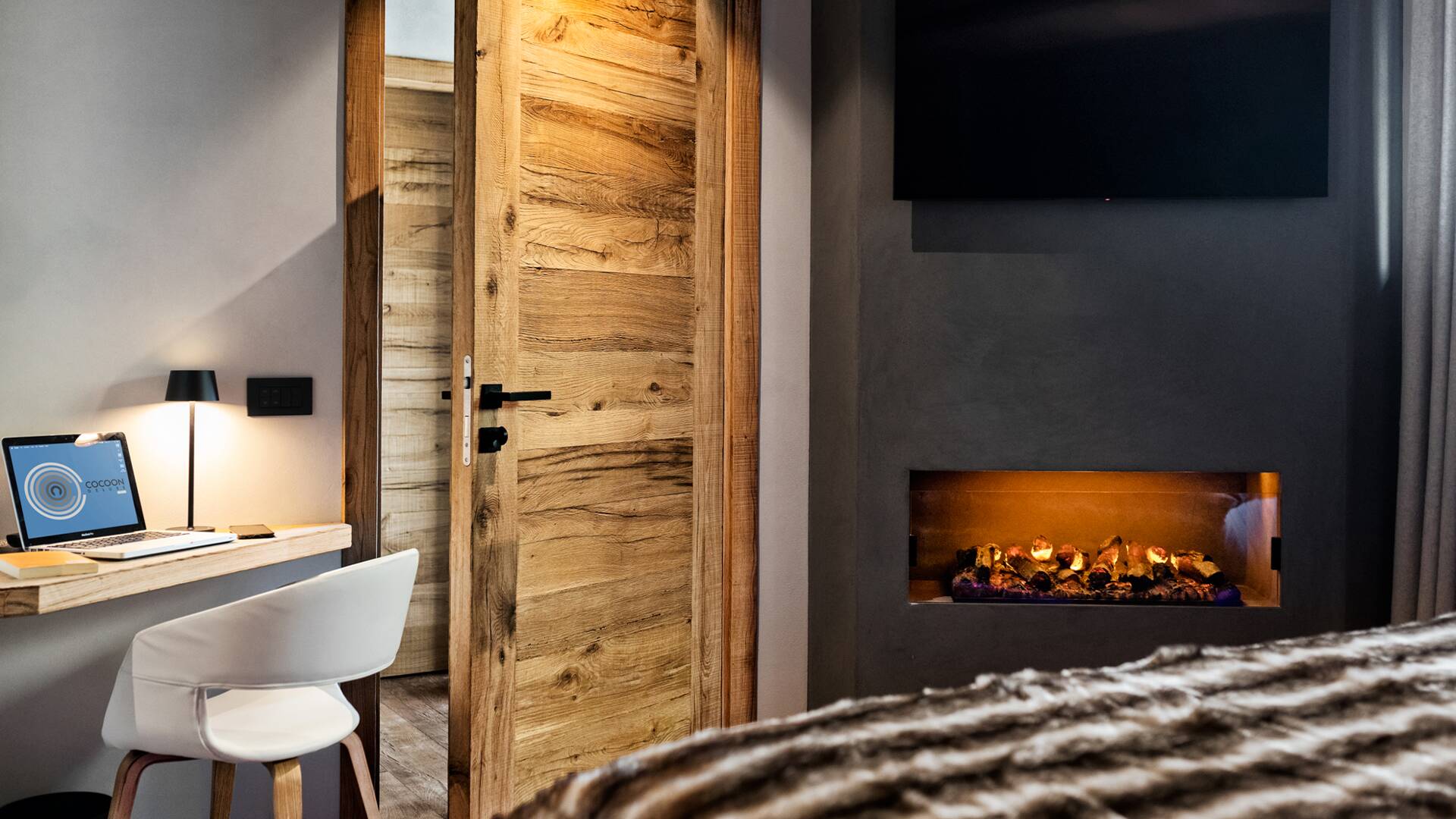 double bedroom with TV and fireplace