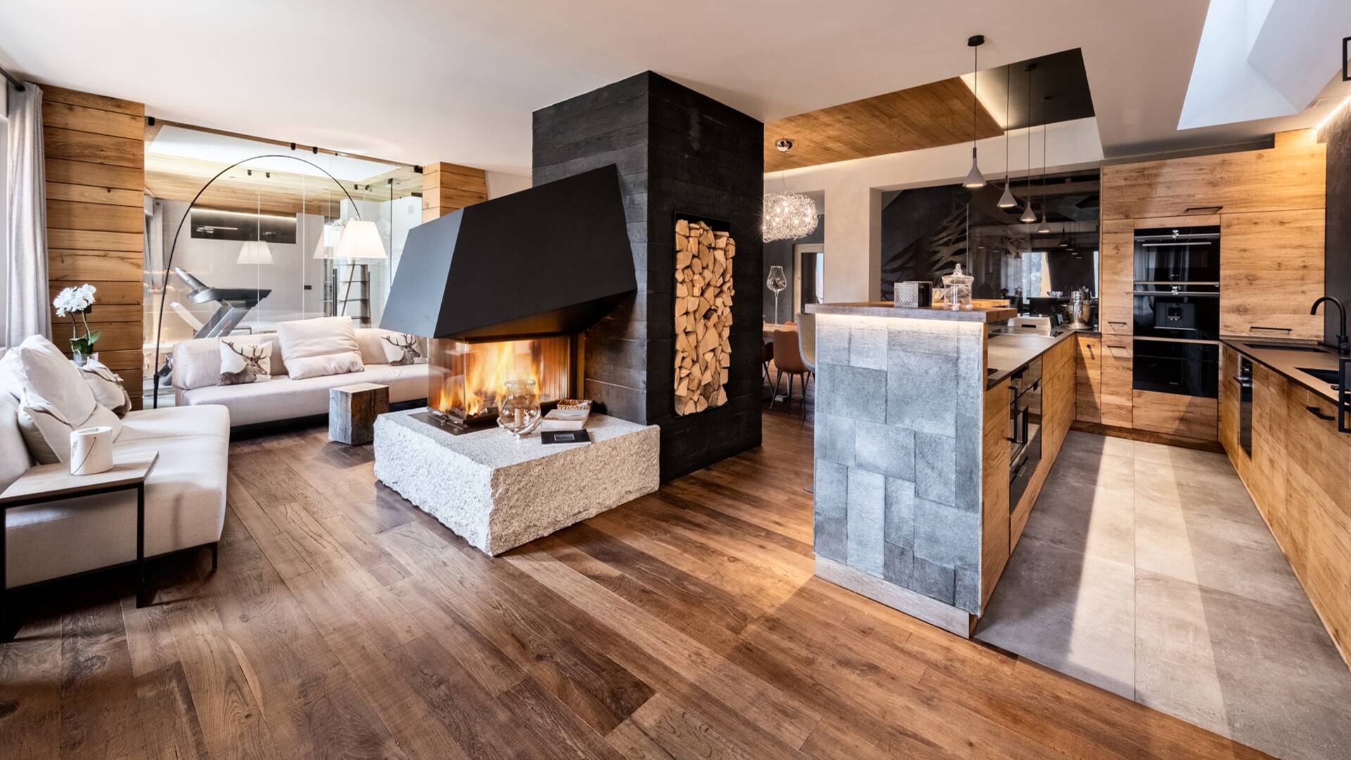 living room with fireplace and cooking island
