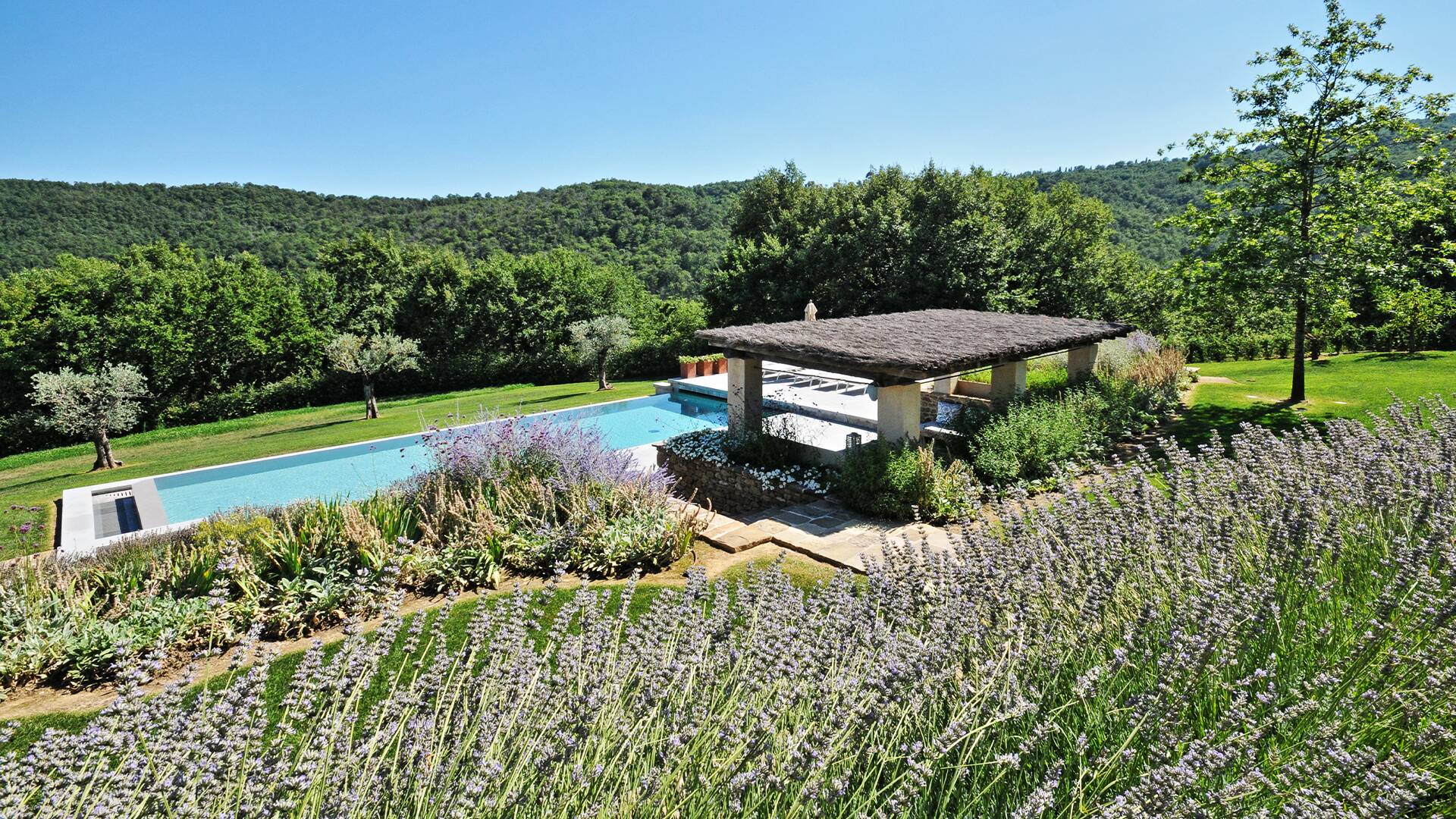 covered sunbathing area with private pool