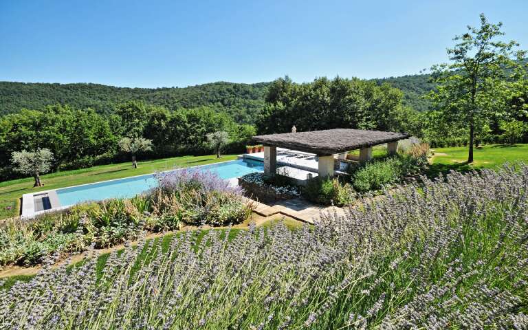 covered sunbathing area with private pool