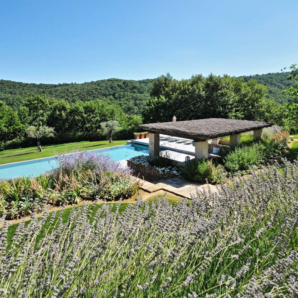 covered sunbathing area with private pool