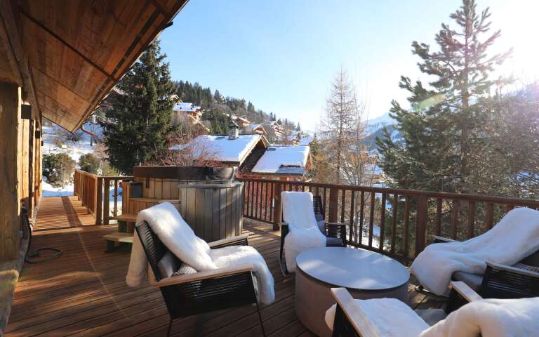outdoor sitting area with Jacuzzi hot tub