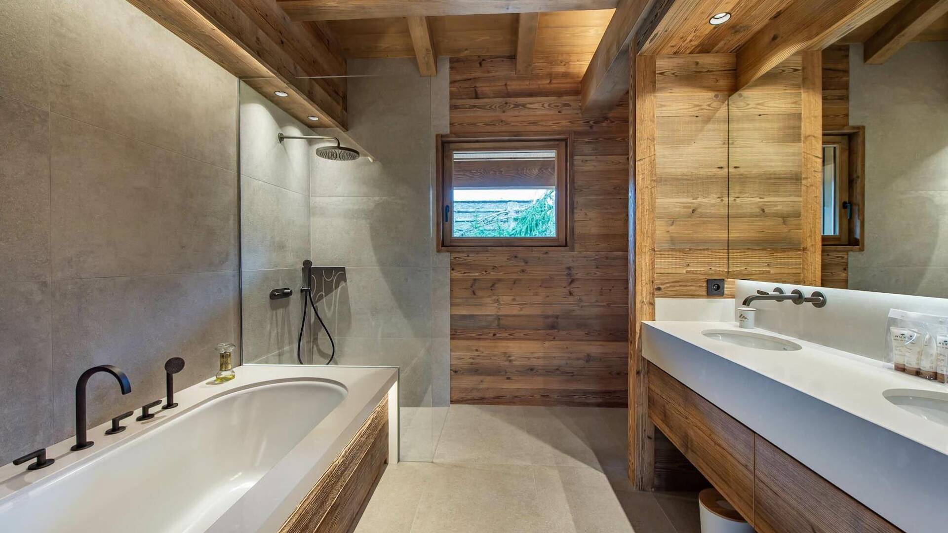 en suite bathroom with bath tub and shower cabin