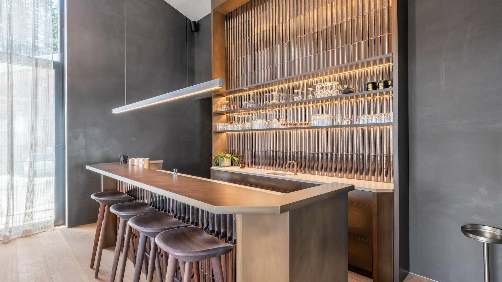 bar with sleek counter and stools