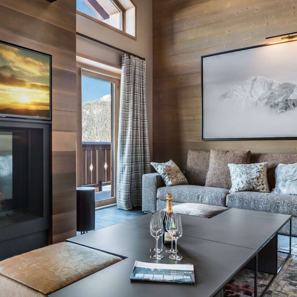 living room with TV, fireplace and French windows