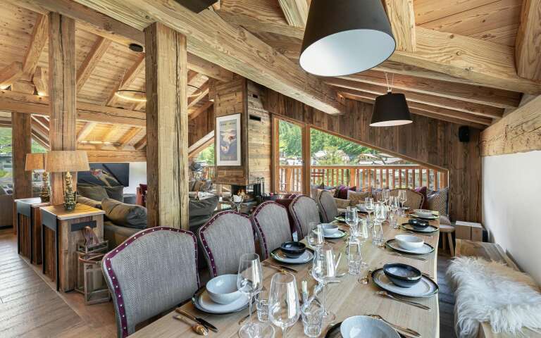 dining table and spacious living room with French windows