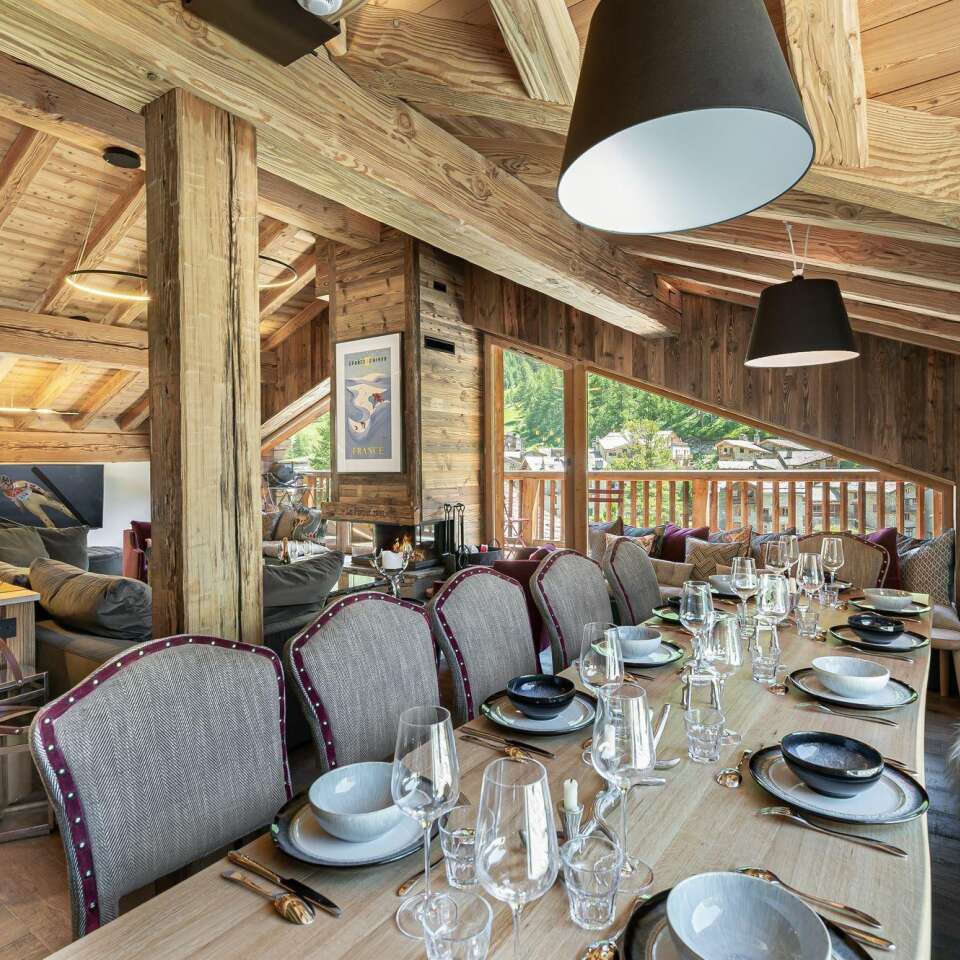 dining table and spacious living room with French windows