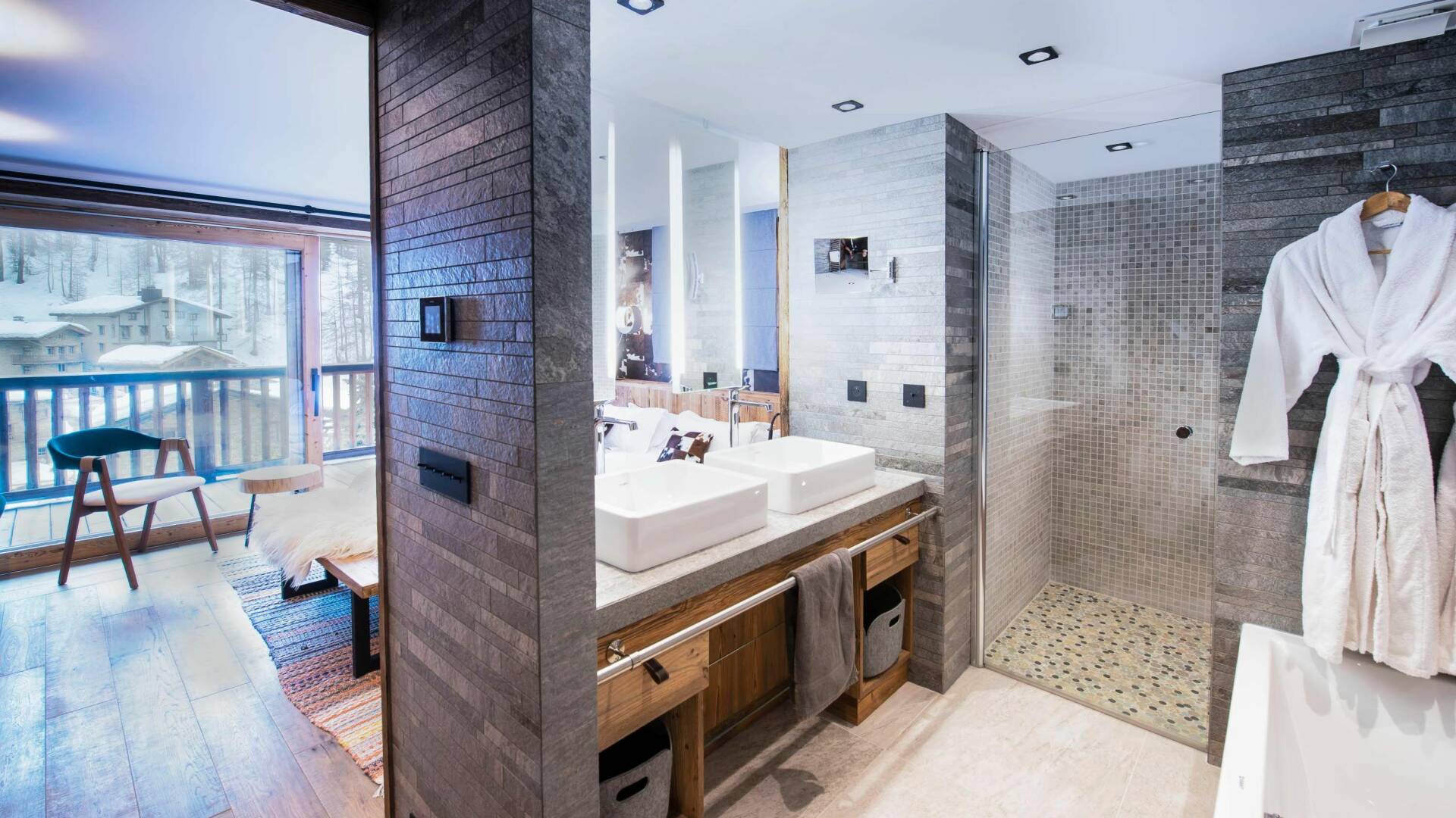 en suite bathroom with double lavabo and shower cabin