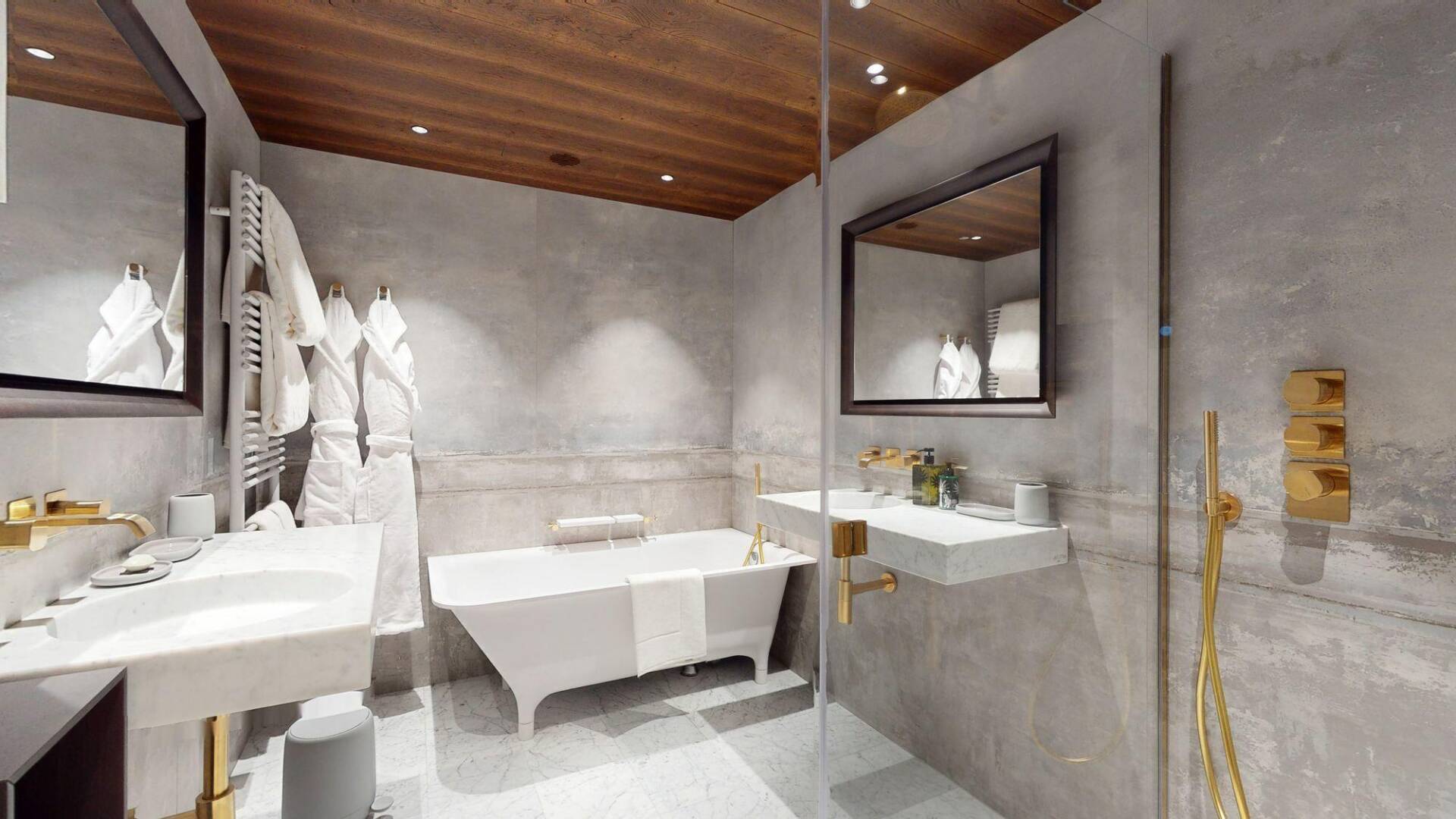 en suite bathroom with double lavabo and bath tub
