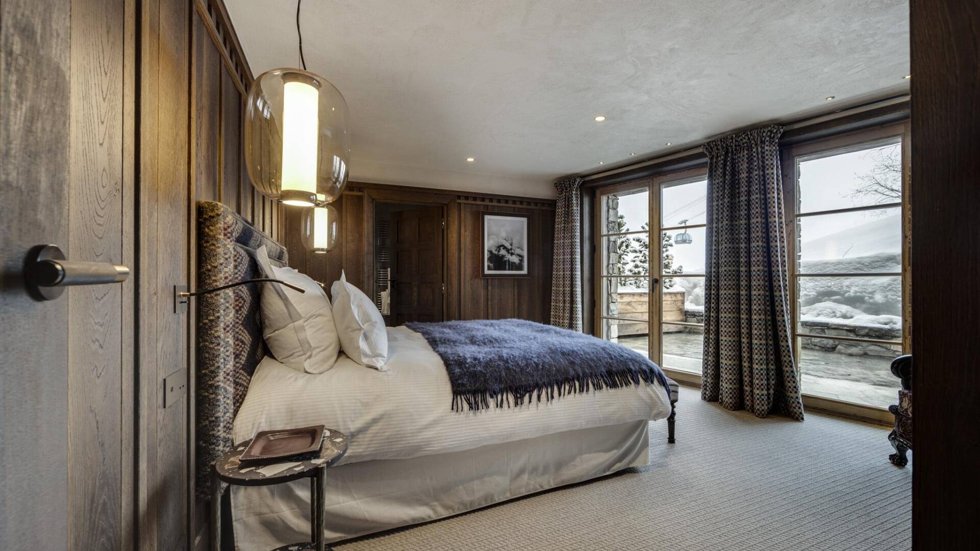 double bedroom with French windows and access to outdoor