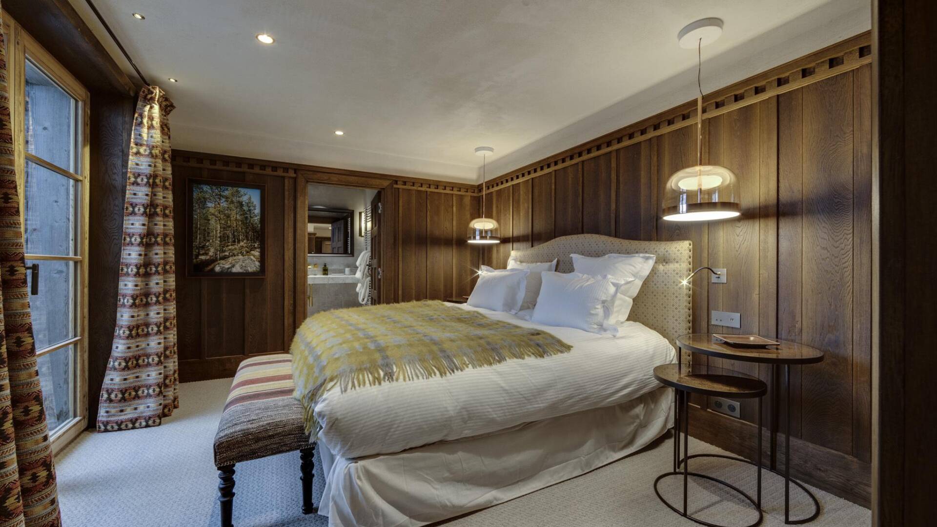 double bedroom with access to balcony and en suite bathroom