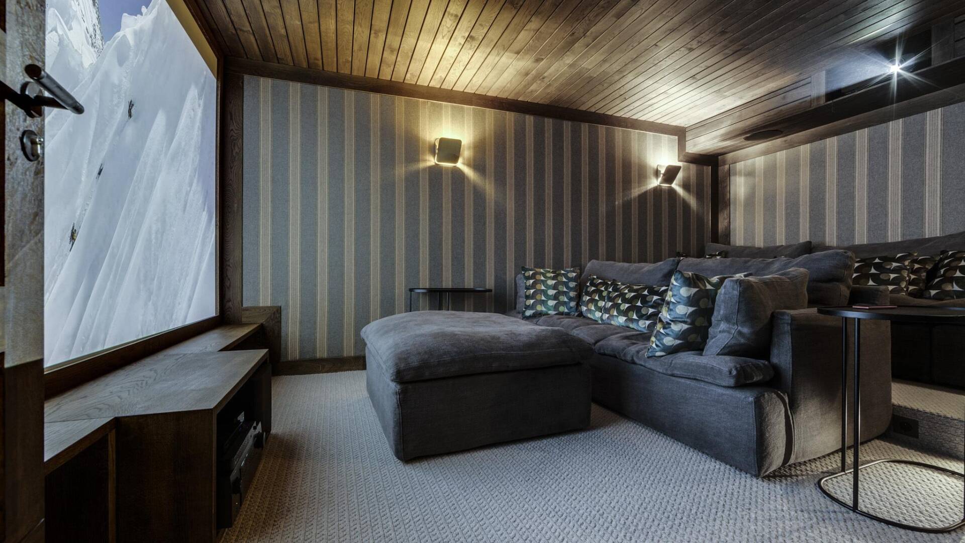 cinema room with cosy sofas and large screen