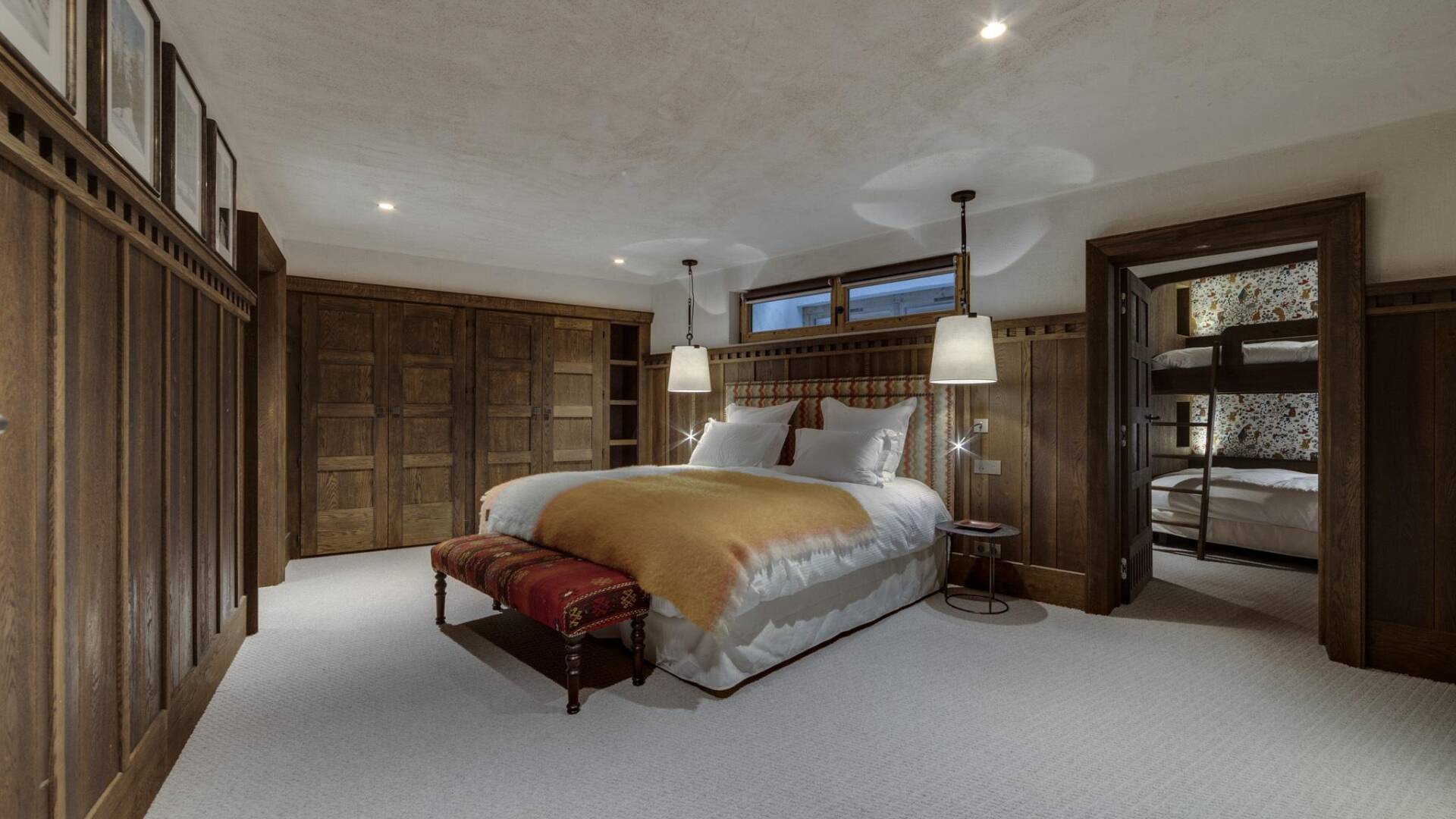spacious double bedroom with access to bedroom with bunk beds