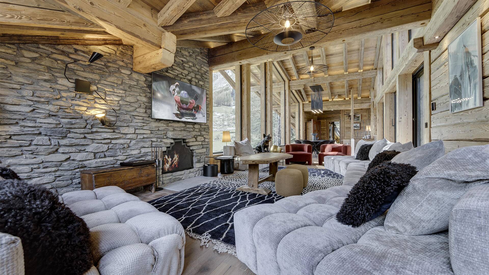 majestic living room with TV, cosy sofas and fireplace
