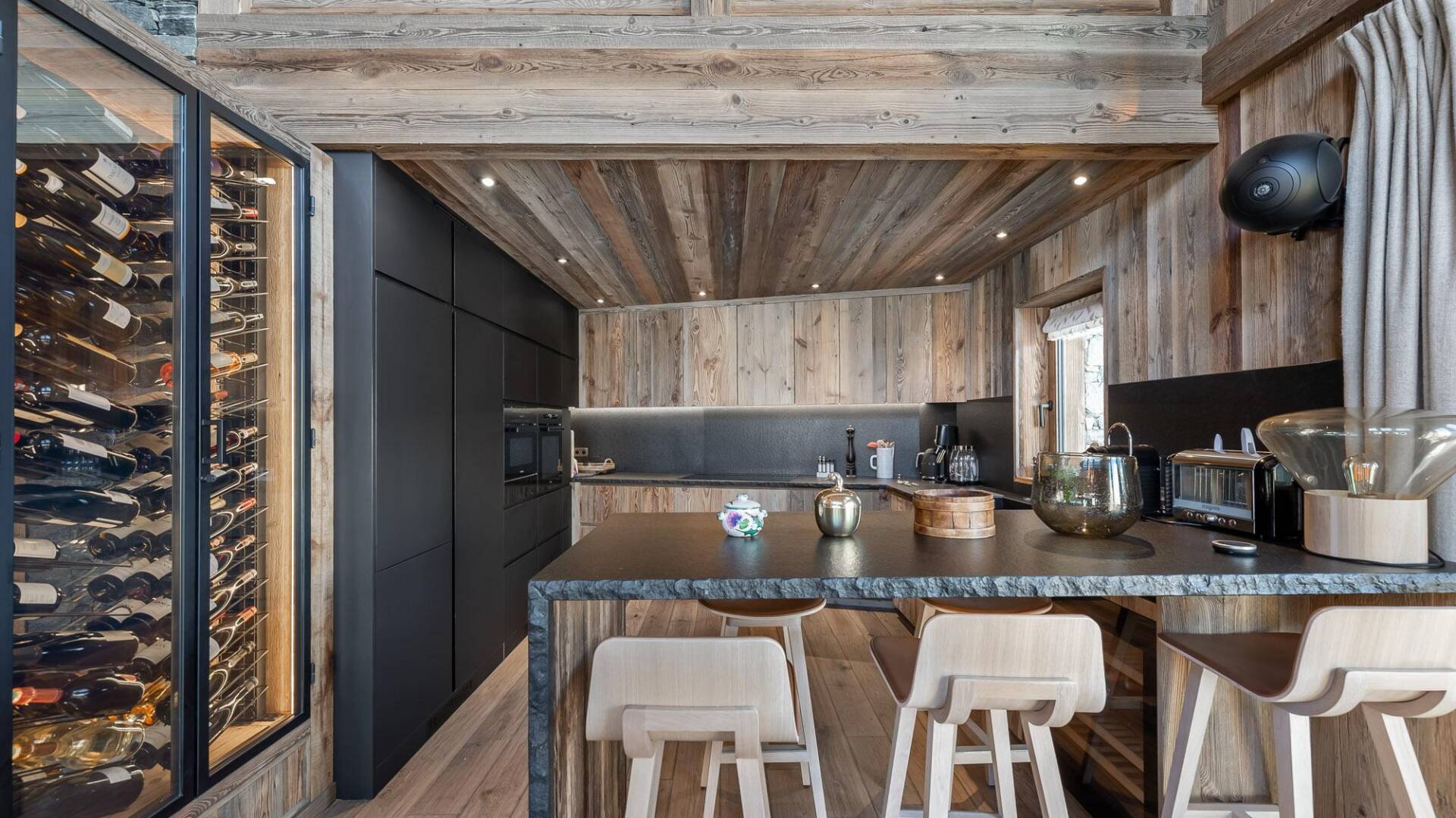 gourmet kitchen with counter bar and stools