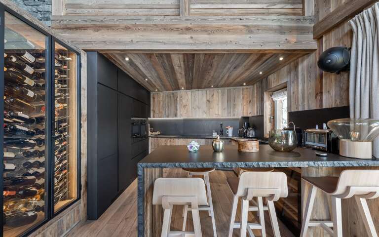 gourmet kitchen with counter bar and stools