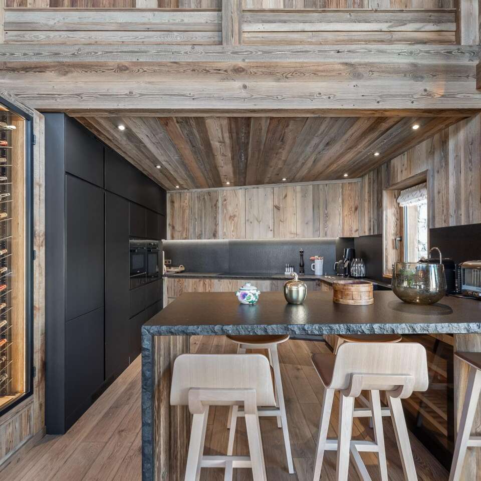 gourmet kitchen with counter bar and stools