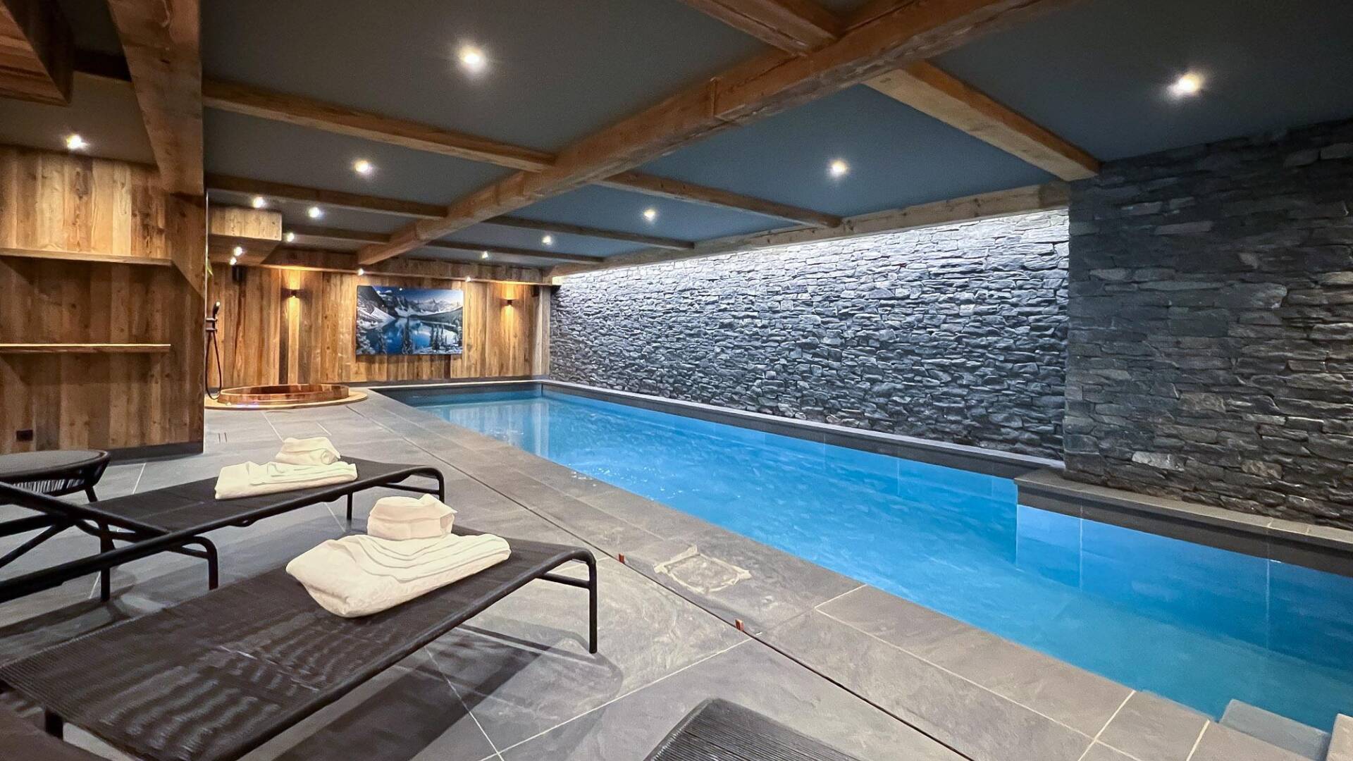 luxury indoor pool with sunbeds