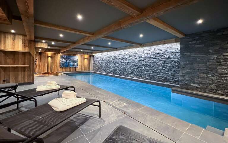 luxury indoor pool with sunbeds