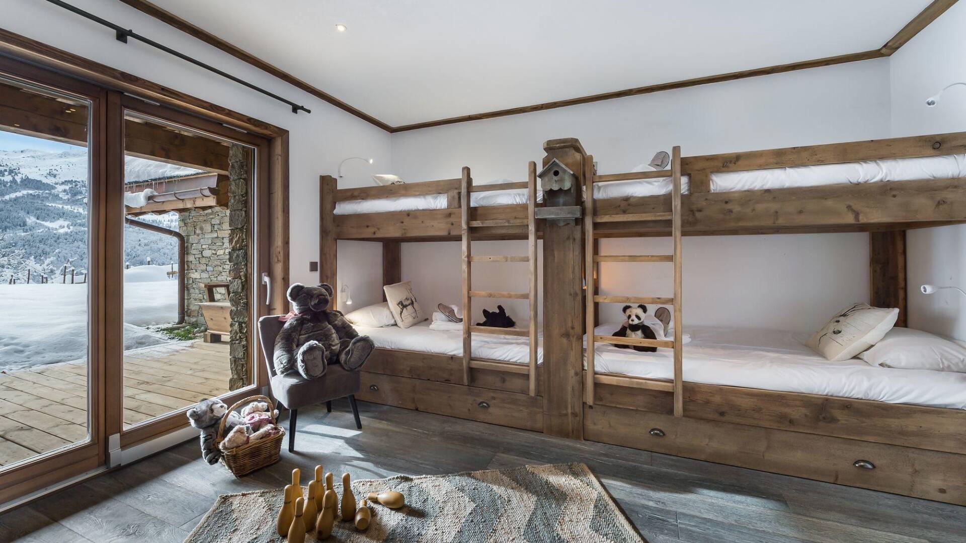quadruple bedroom with 2 sets of bunk beds and access to outdoor