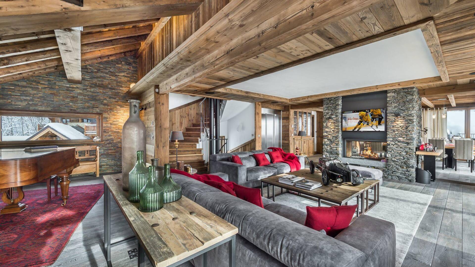 elegant living room with piano and fireplace