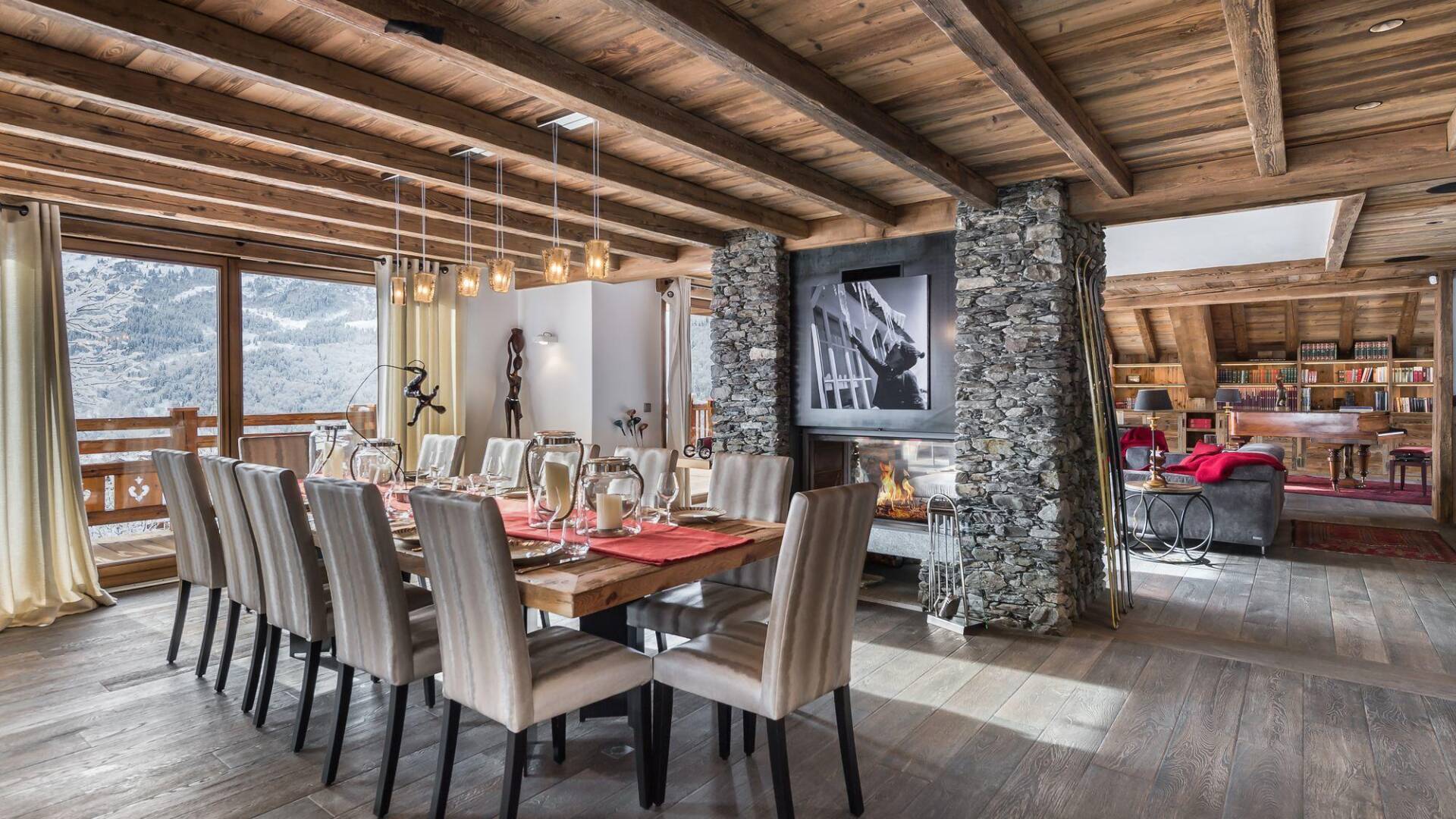modern dining area with TV, fireplace and access to outdoor
