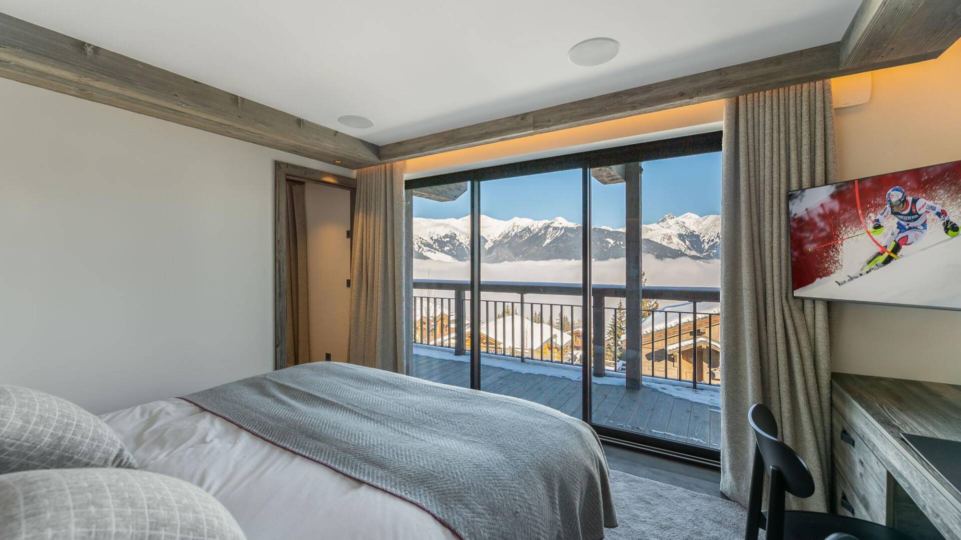 double bedroom with TV and balcony