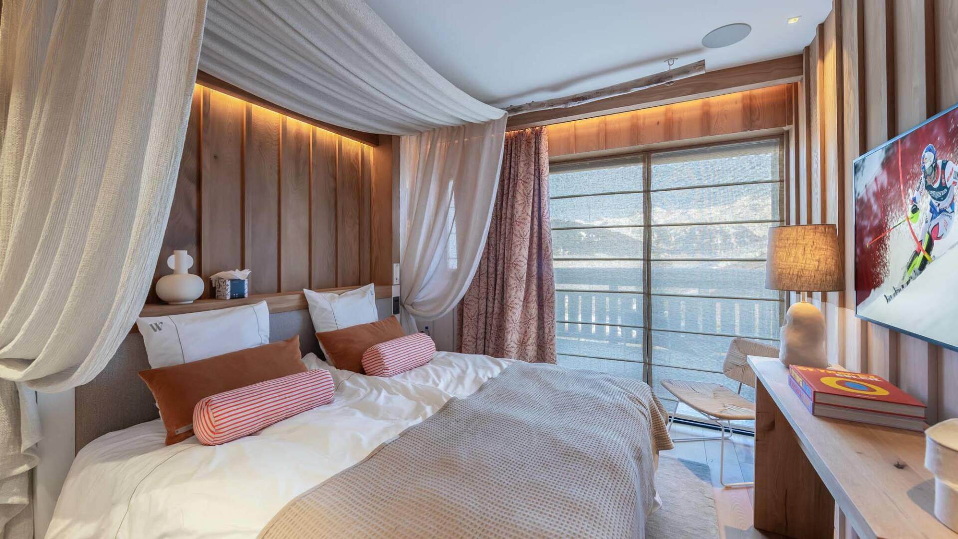 luxury double bedroom with TV and access to outdoor