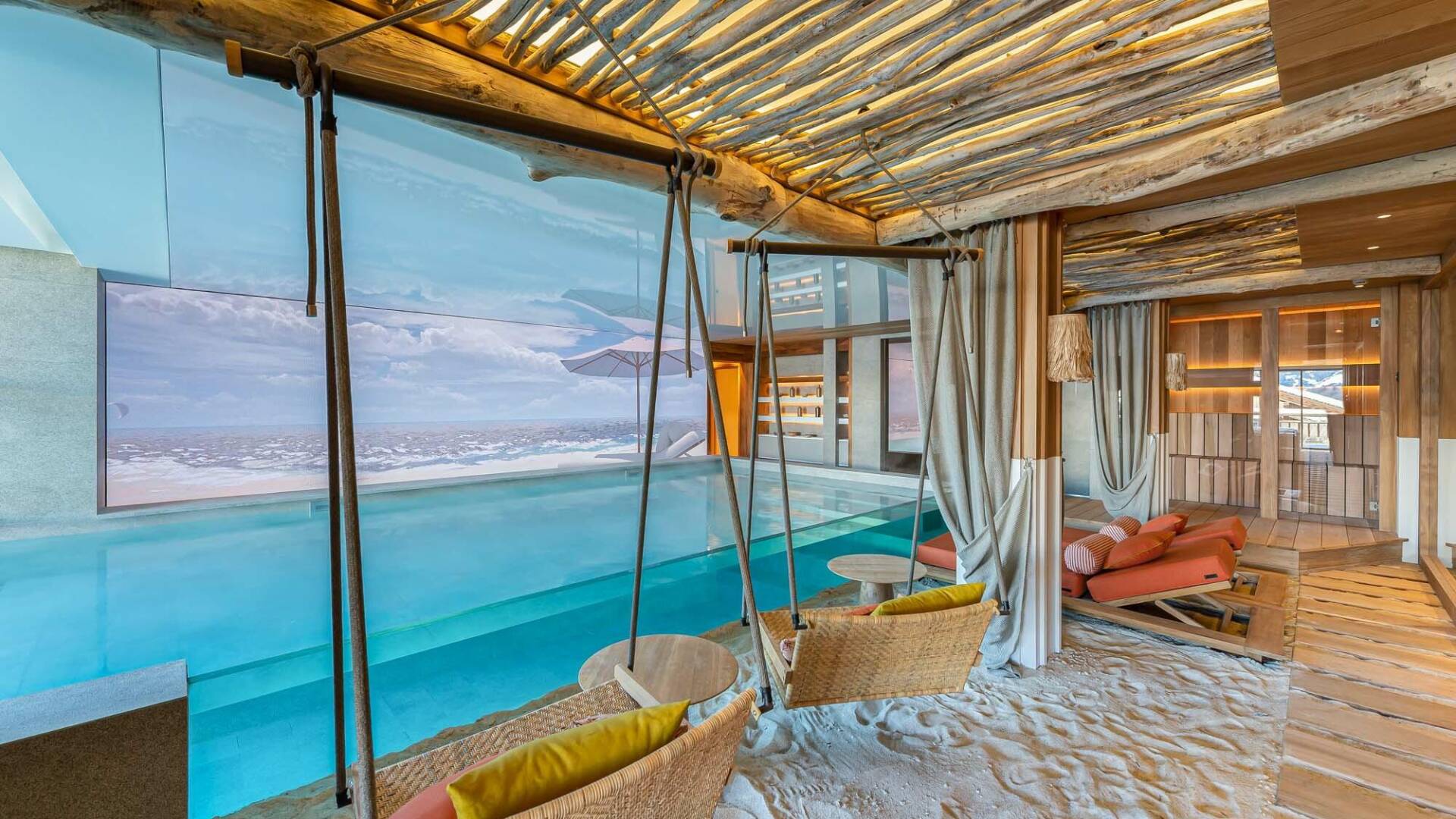 top luxury indoor/outdoor pool with swings and white sand