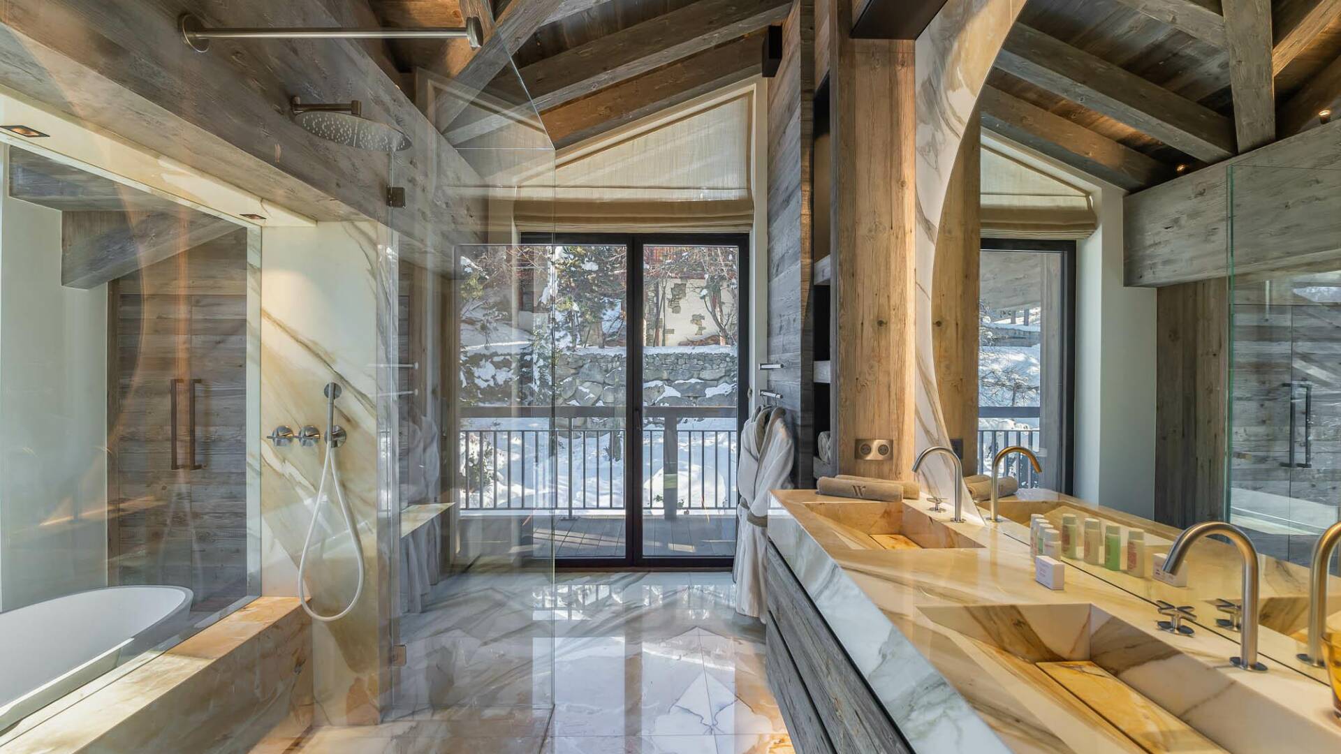 en suite luxury marble bathroom with double walk-in shower, bath tub and double lavabo