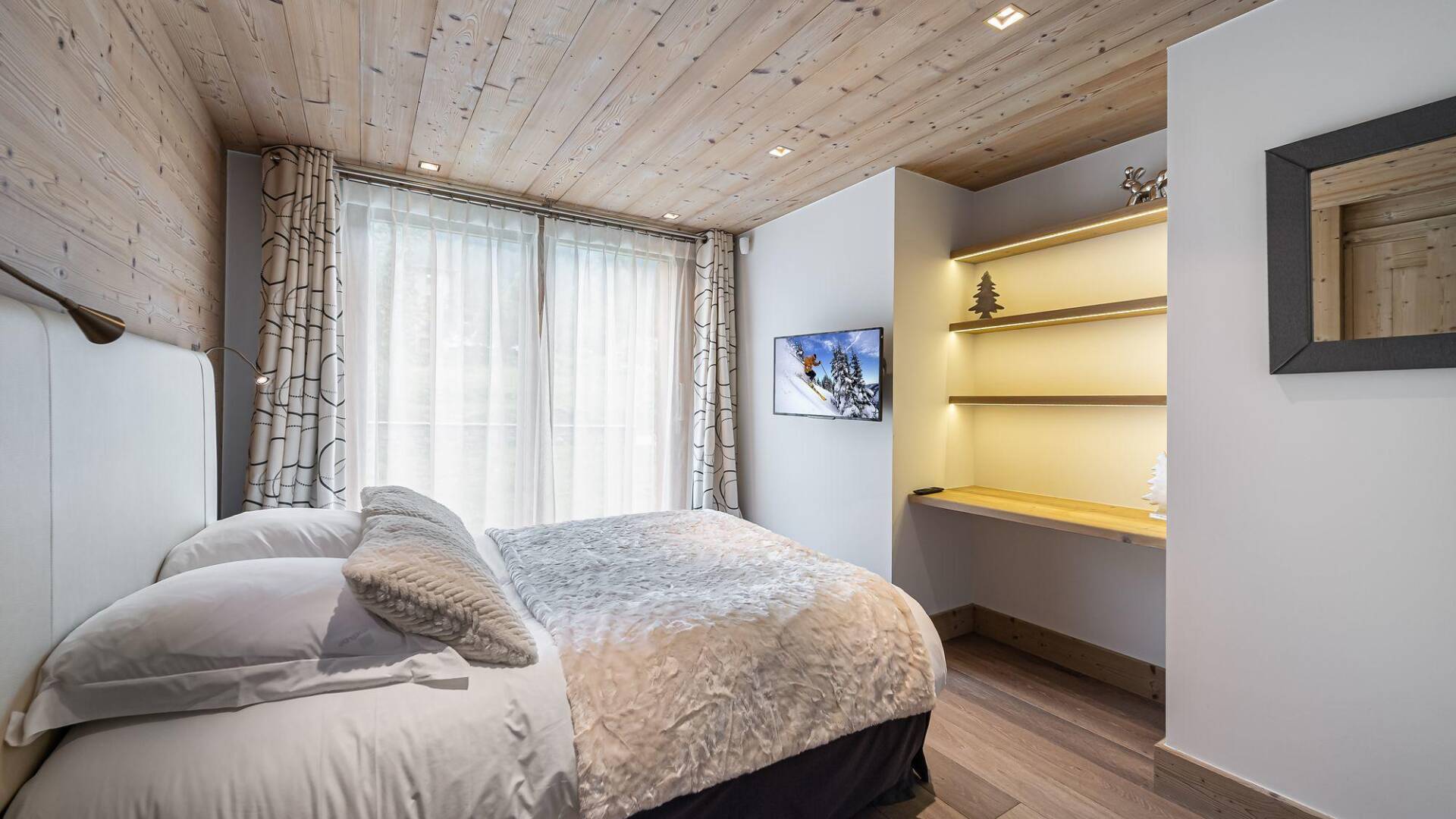 double bedroom with access to outdoor and en suite bathroom