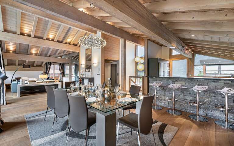 luxury dining area and fully-equipped kitchen with counter bar