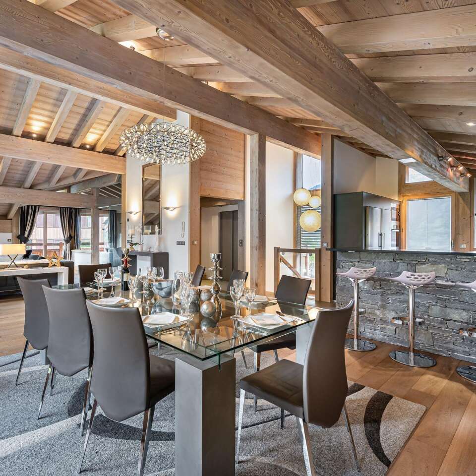 luxury dining area and fully-equipped kitchen with counter bar