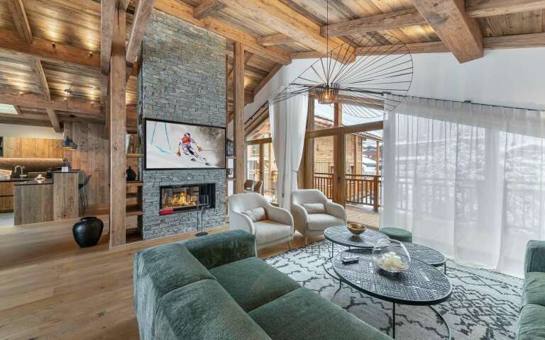 luxury living room with high-end furniture, TV and fireplace