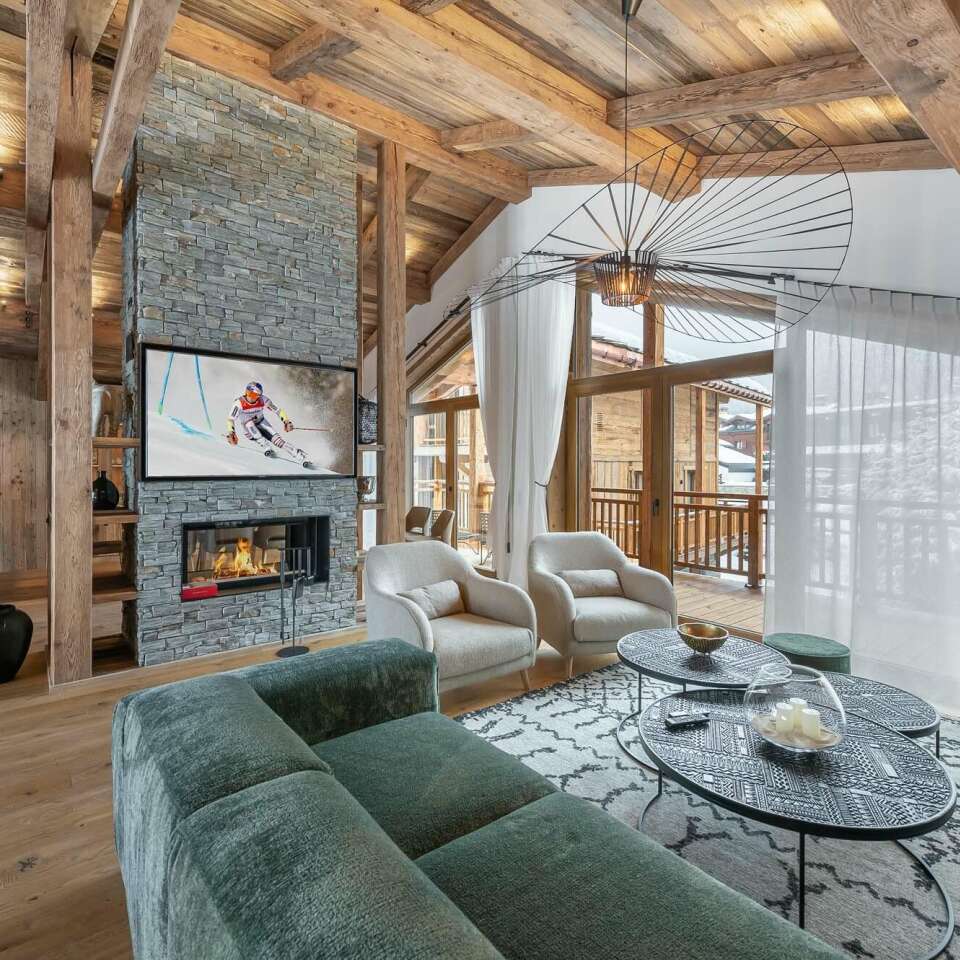 luxury living room with high-end furniture, TV and fireplace