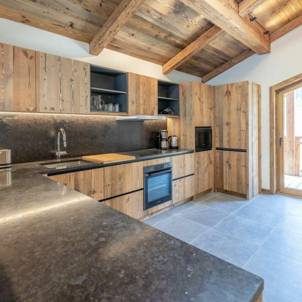 fully-equipped kitchen with access to outdoors